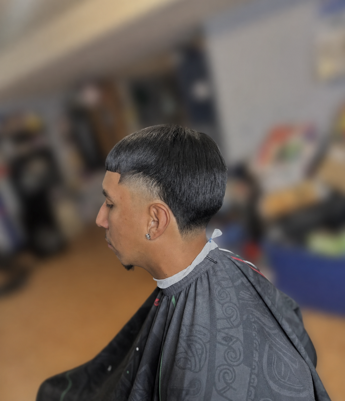Rounded bowl-inspired taper haircut finished with a precise line by Almighty Cutz By Jesus.